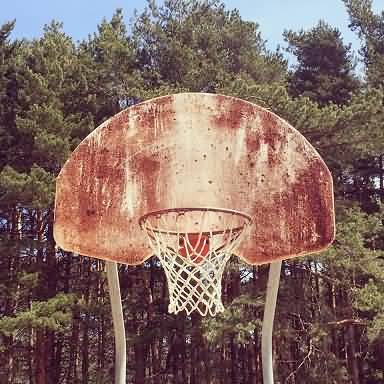 well-used outdoor basketball hoop