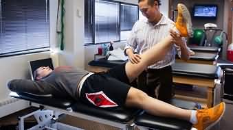 rehabbing with an athletic trainer